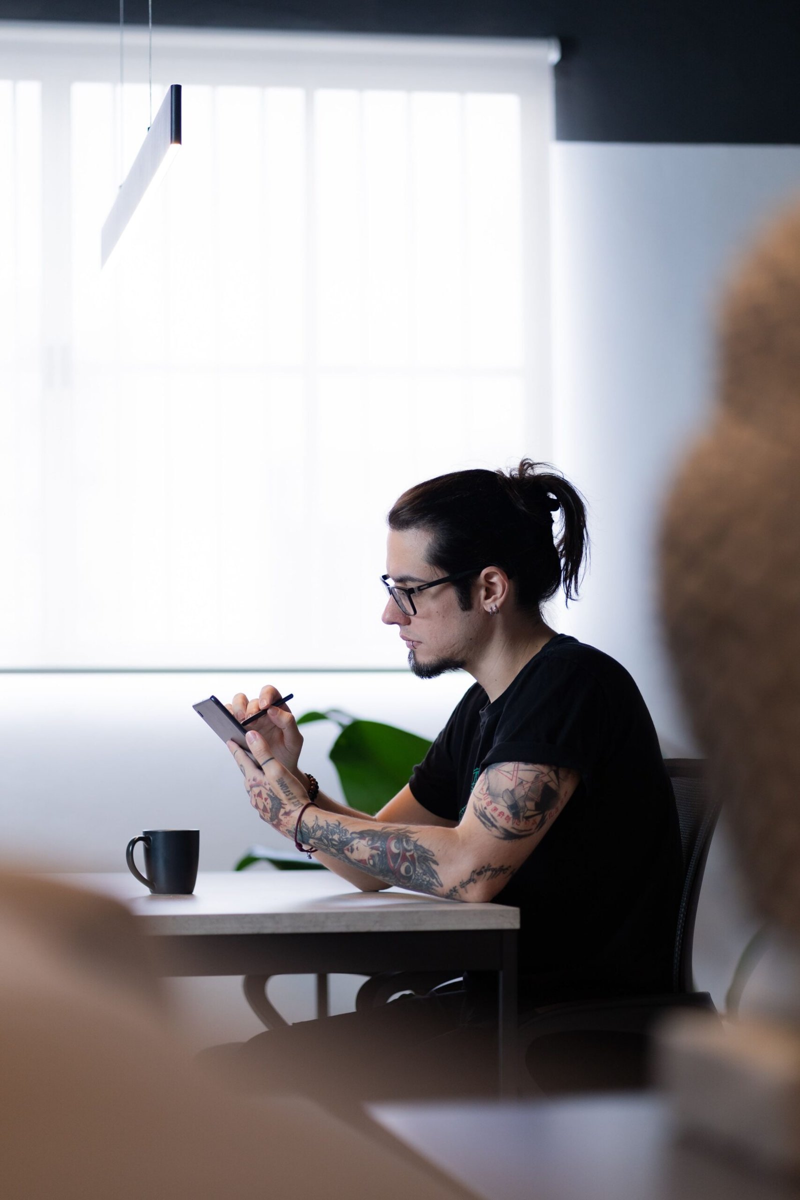 Adult man working at a calm modern desk