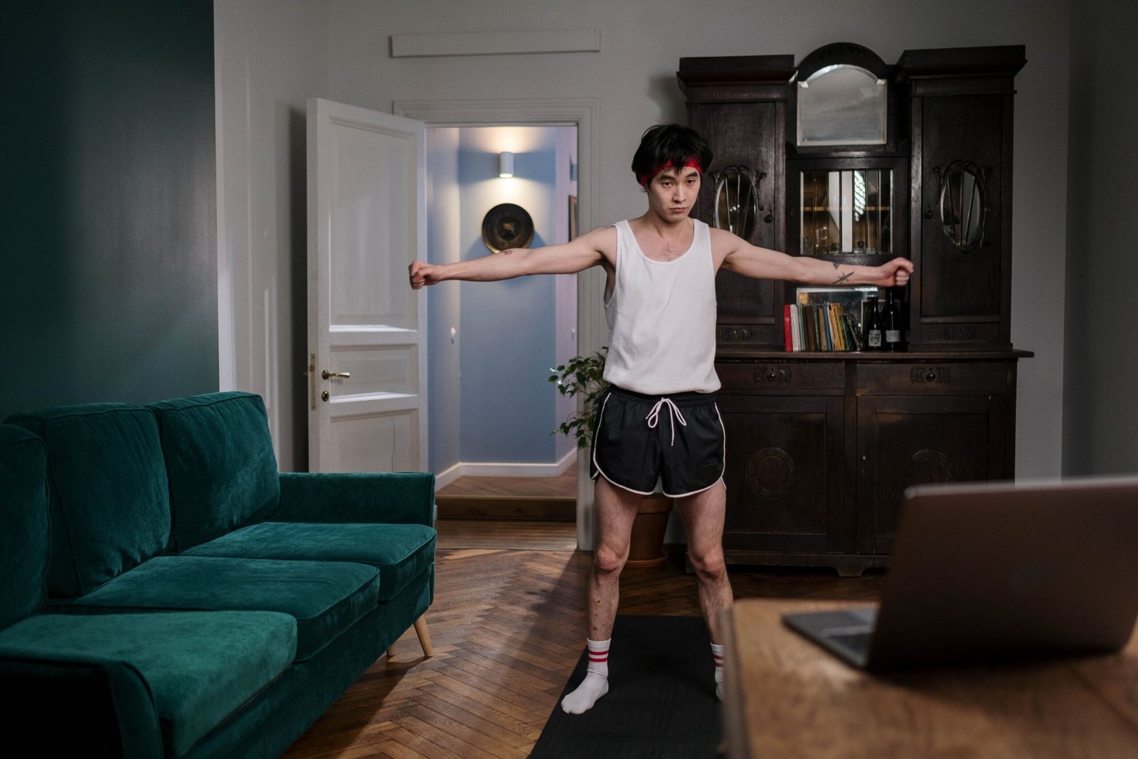 Man exercising at home with simple bodyweight movements